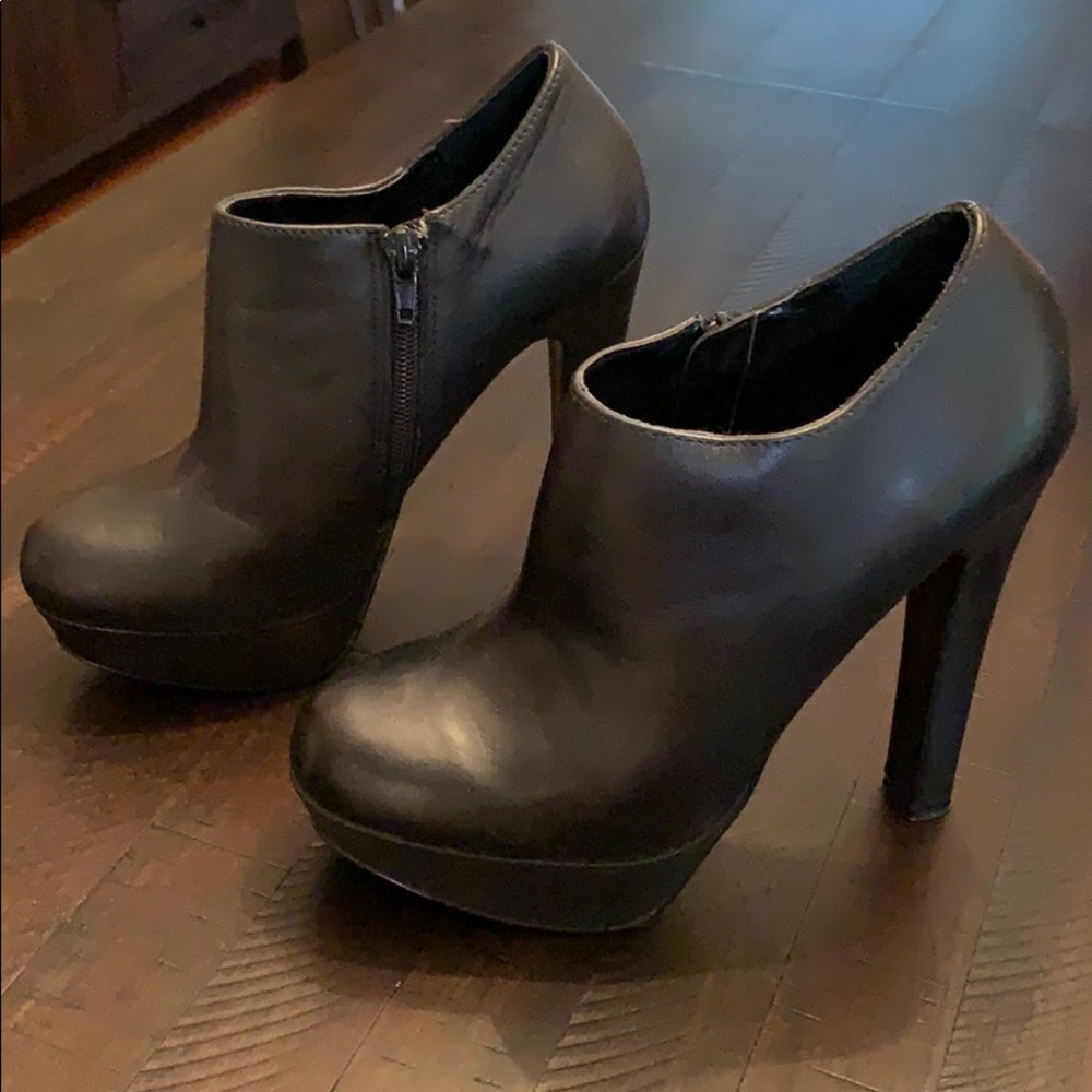 Women’s black high heel booties.